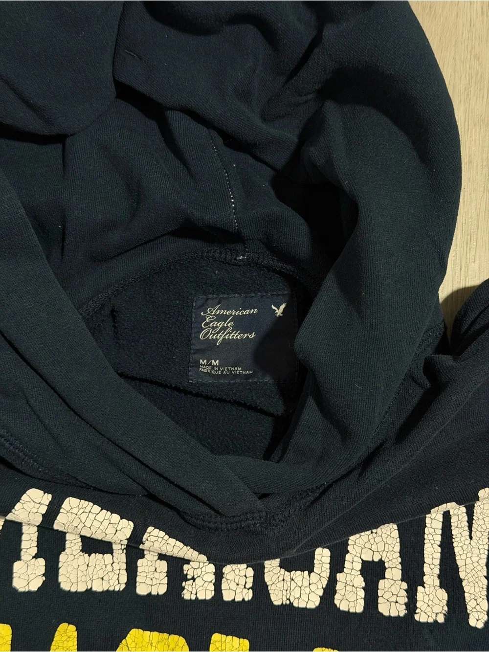 American Eagle Outfitters Navy Pullover Hoodie with White & Yellow Logo